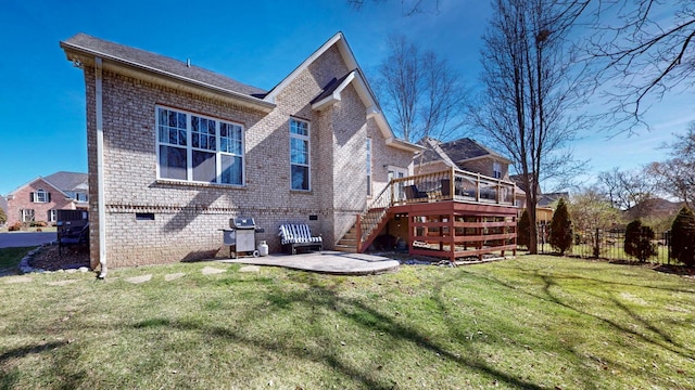 back of property with brick siding, stairs, crawl space, a lawn, and a wooden deck