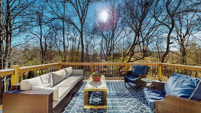 wooden terrace featuring an outdoor living space