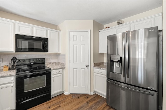 kitchen featuring black appliances, white cabinetry, decorative backsplash, and dark wood-type flooring