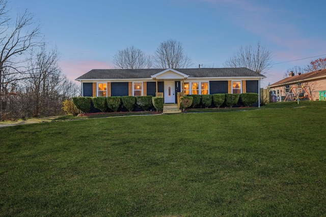 view of front of house with a front lawn and brick siding