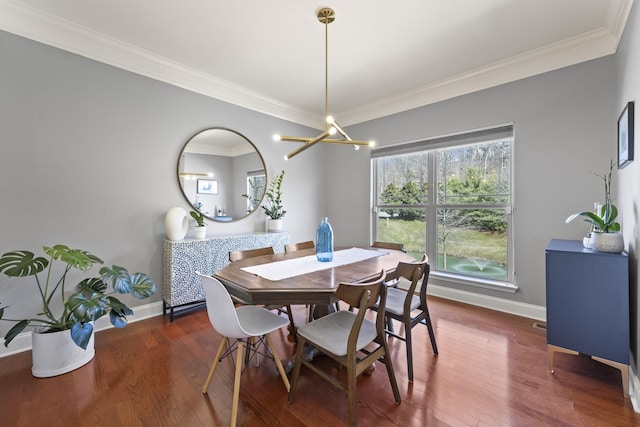 dining room with baseboards, dark wood-style flooring, and ornamental molding