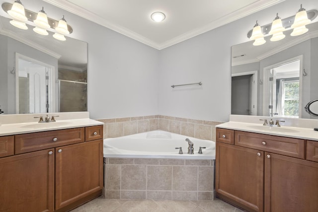 bathroom with crown molding, a sink, and tile patterned floors