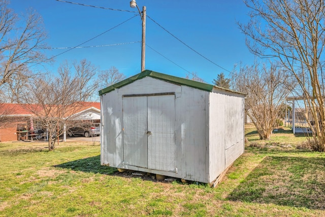 view of shed featuring a carport