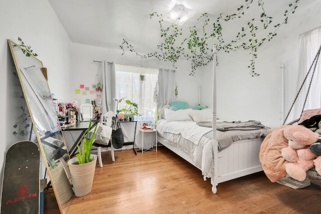 bedroom with wood finished floors