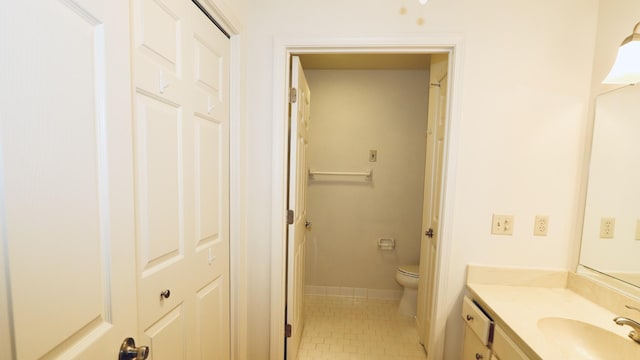 full bath with vanity, tile patterned flooring, toilet, and baseboards