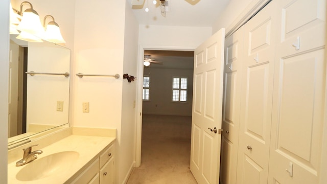 bathroom featuring a ceiling fan and vanity