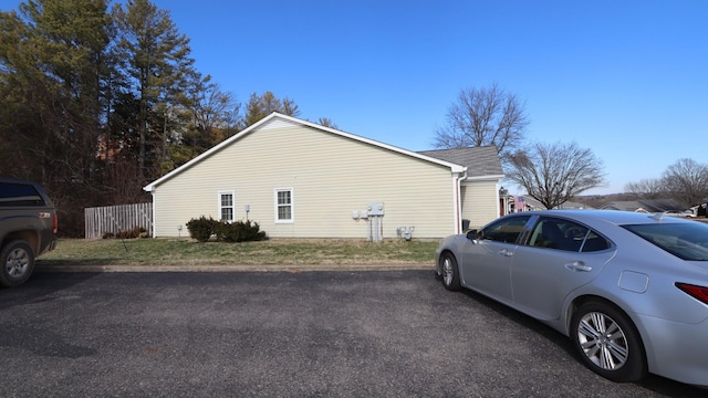 view of property exterior featuring fence