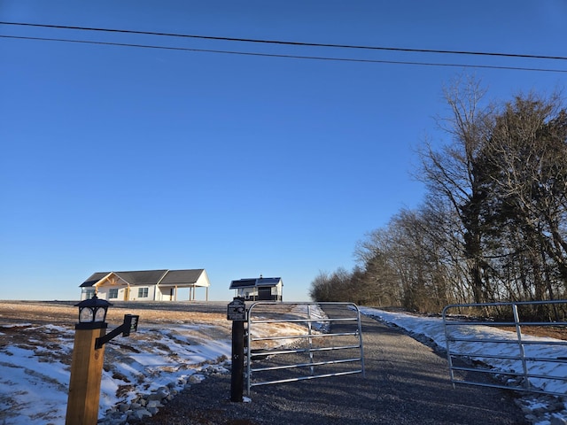 exterior space featuring driveway, a gated entry, and a gate