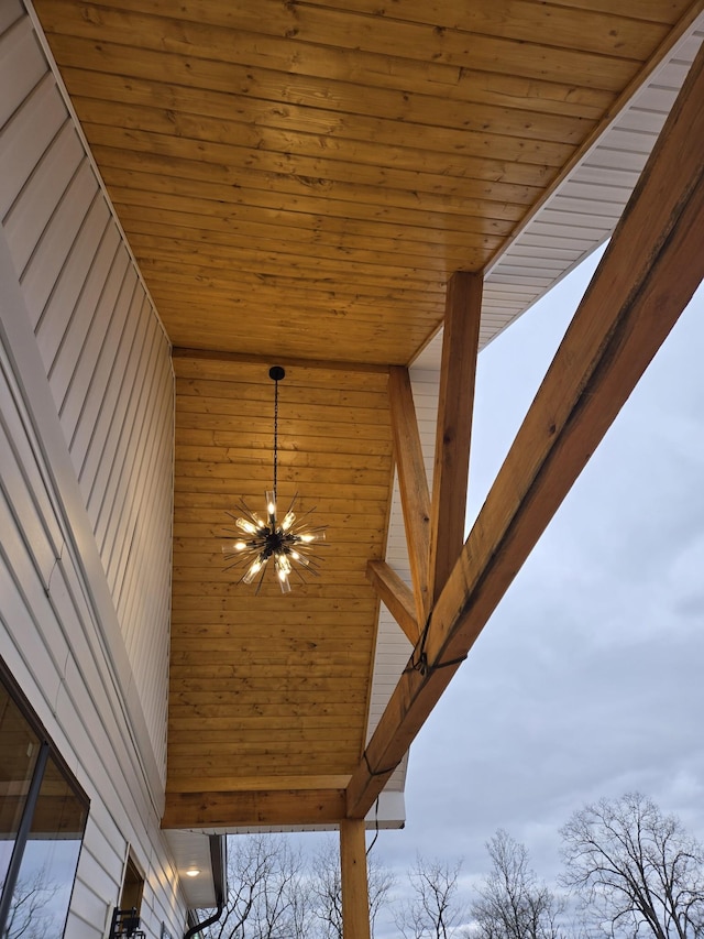 exterior details featuring an inviting chandelier