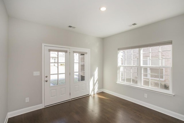 entryway featuring baseboards, visible vents, dark wood finished floors, and recessed lighting