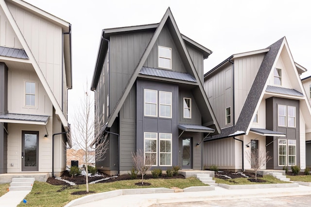 view of front of property featuring board and batten siding and metal roof