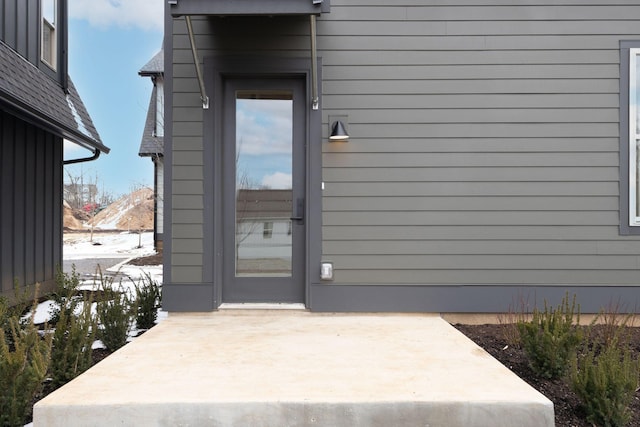 entrance to property with a patio