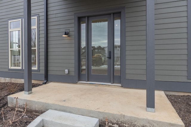 property entrance featuring a patio area