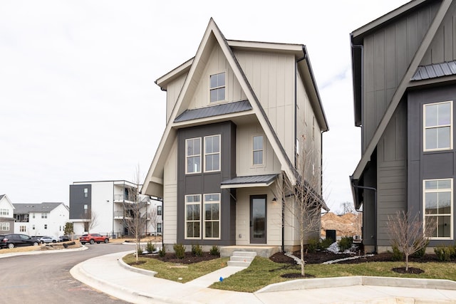 view of front facade with metal roof and board and batten siding