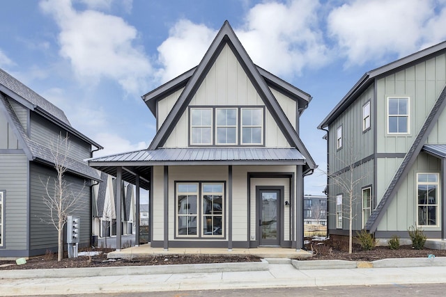 view of front of property with metal roof, a porch, and board and batten siding