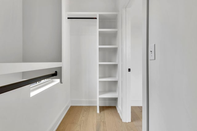 walk in closet featuring light wood-style floors