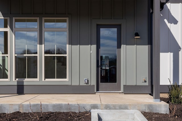 entrance to property featuring board and batten siding