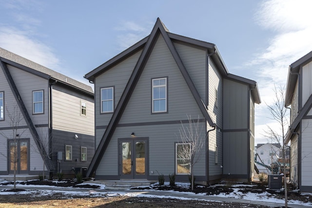 view of front facade with central AC and french doors