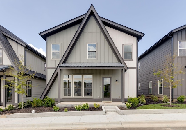 406 Morningside Mnr, Nashville, TN 37209 - view of front of property featuring board and batten siding, covered porch, and metal roof