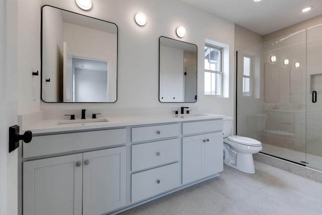 full bath with a stall shower, a sink, toilet, and double vanity