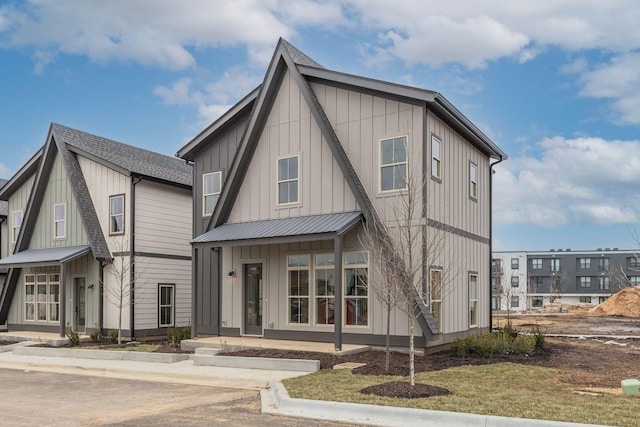 view of front facade featuring metal roof and board and batten siding