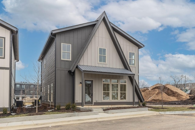 view of front of home with metal roof and board and batten siding