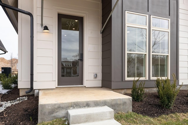 doorway to property with central AC