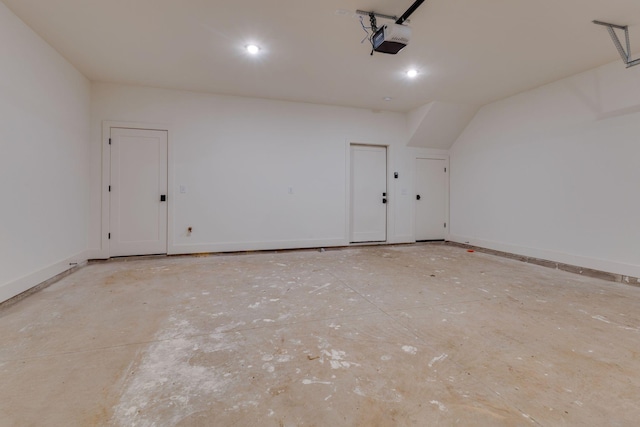 garage featuring baseboards, recessed lighting, and a garage door opener