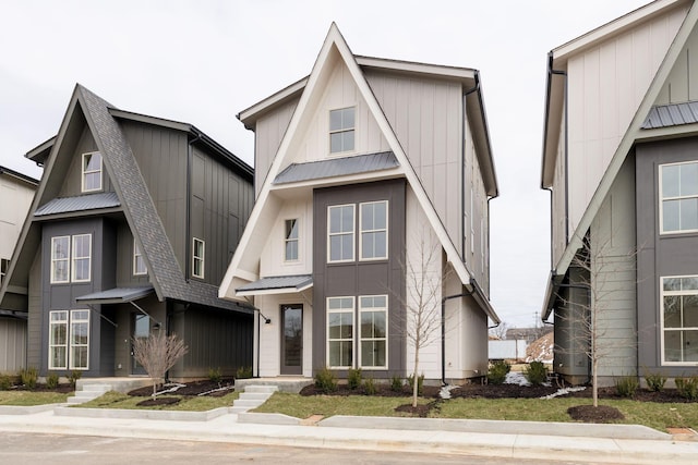 view of front of house featuring a standing seam roof, metal roof, and board and batten siding