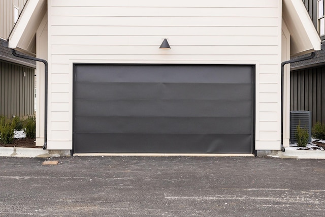 garage featuring driveway