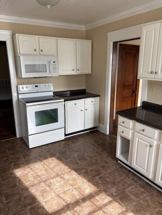 kitchen with ornamental molding, white appliances, dark countertops, and white cabinetry