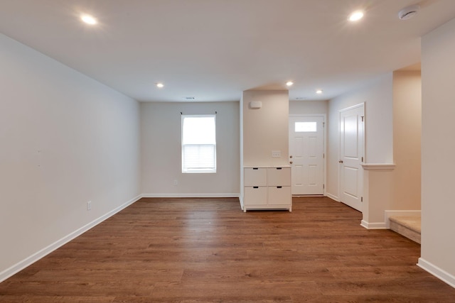 unfurnished room featuring visible vents, baseboards, dark wood-type flooring, and recessed lighting