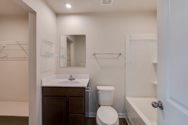 full bathroom with baseboards, visible vents, toilet, a spacious closet, and vanity