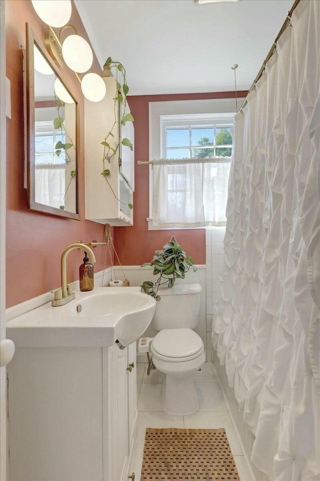 bathroom with toilet, a shower with shower curtain, tile patterned flooring, and vanity