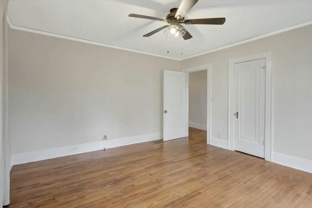 unfurnished bedroom with baseboards, ceiling fan, ornamental molding, and light wood-style floors