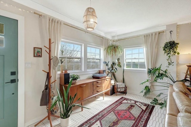 sitting room featuring baseboards