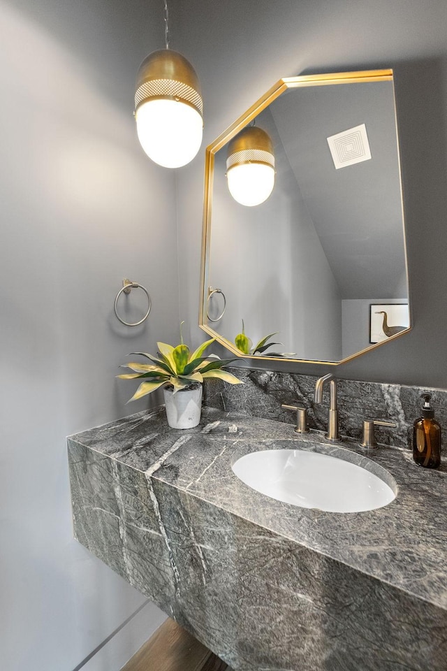 bathroom featuring vanity and visible vents