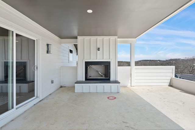 view of patio / terrace with a large fireplace