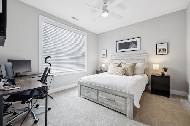 bedroom with baseboards, a ceiling fan, visible vents, and light colored carpet