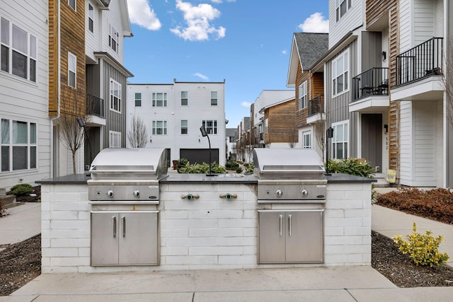 view of patio / terrace featuring area for grilling and a grill