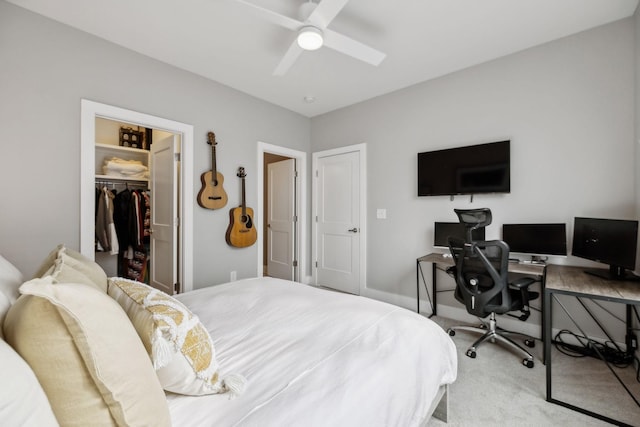 bedroom featuring carpet floors, a closet, a walk in closet, and a ceiling fan