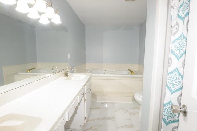 bathroom featuring double vanity, toilet, a bath, marble finish floor, and a sink