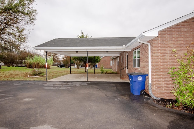 view of parking featuring aphalt driveway