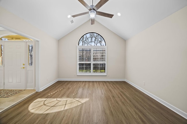 foyer entrance featuring visible vents, lofted ceiling with beams, ceiling fan, wood finished floors, and baseboards