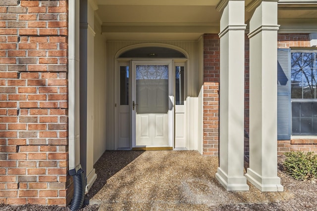 property entrance with brick siding