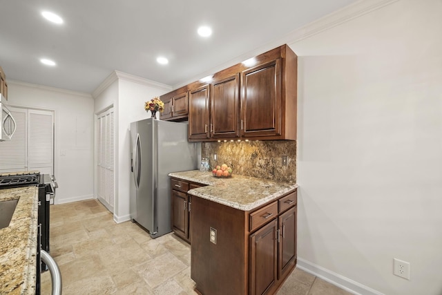 kitchen featuring stainless steel appliances, ornamental molding, light stone countertops, and decorative backsplash