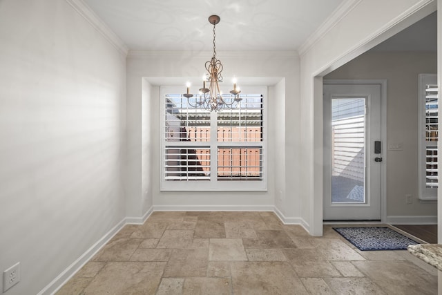 unfurnished dining area with baseboards, a chandelier, stone tile flooring, and ornamental molding