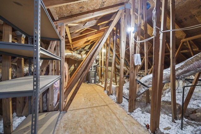 attic featuring heating unit