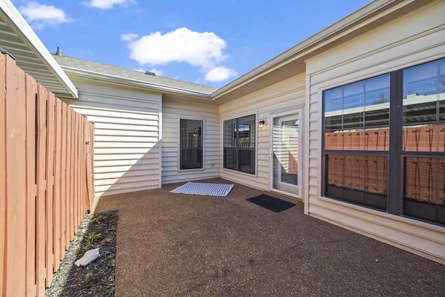 view of patio / terrace featuring fence