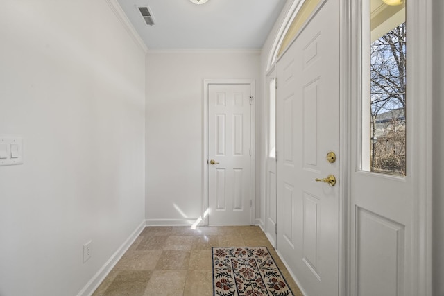 doorway to outside featuring visible vents, crown molding, and baseboards